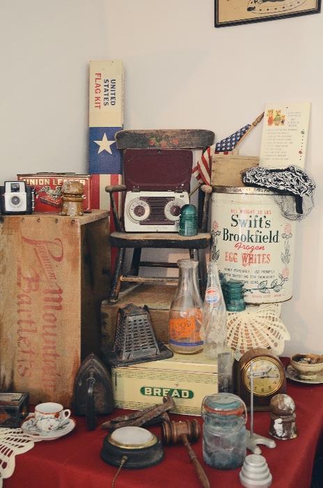 Antique stovetop toaster, Swift's Frozen Egg Whites Tin, vintage bread box, antique children's chair, ceramic insulators, vintage milk bottle 