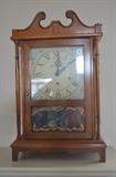 Shelf/Mantle Clock solid Walnut very heavy quality with German works. Beautiful condition with awesome sounding Chimes! Comes with Key, Pendulum & super Clean!