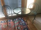 Wrought iron garden bistro set with glass top
