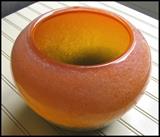 Beautiful shades or orange on this glass bowl