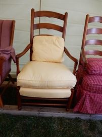 Pair of Hickory ladder backed arm chairs, each has yellow leather or the red and white covers.