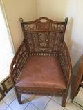 W.E. Smithe arm chair w/leather seat, Asian influence. We have a pair of these