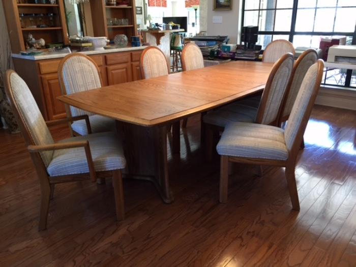 Oak Table showing with two leaves & 6 chairs & 2 armchairs