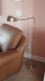 Two brass lamps for sale. Not the leather chair.