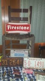 Firestone tire holder (two sides), ladder back chair, vintage license plates, knives, & other advertising. 