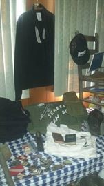 Military uniforms, bags (Seabees decorated), Bibles, trenching shovel (WWII era), pocket compass (WWII era), patches, & much more. 