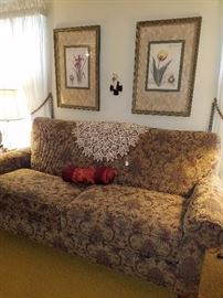 Elegant sofa in like new condition, large crocheted doily, framed prints, & more.