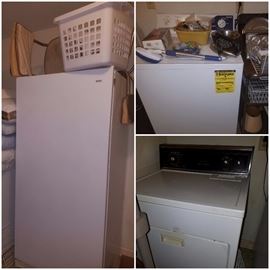 Washer, dryer, & large upright Kenmore freezer. 