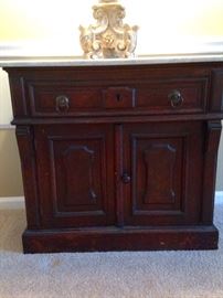 Beautiful antique cabinet with a marble top, sold