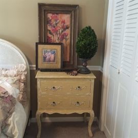 The second of the pair of bedside tables has sold as has the art