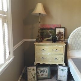 One of the pair of bedside tables