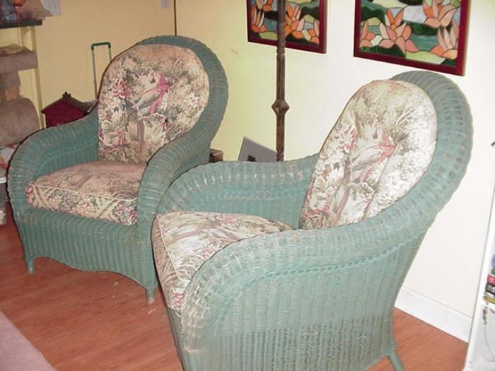 Pair of very vintage wicker arm chairs with parrot theme upholstery on cushions
