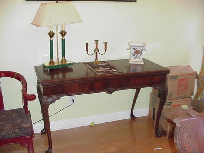 Beautiful mahogany dining table -- top folds open and swivels. Cabriole legs--early 1900s