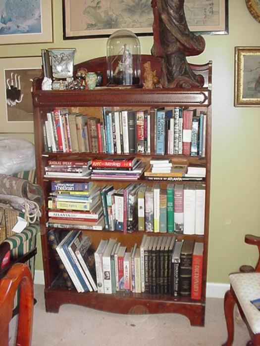 Large turn-of-the-century bookcase with lots of books
