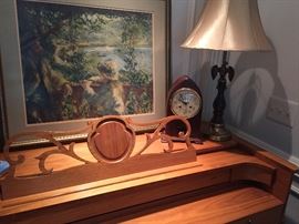 mantel clock, lamp, framed print and beautiful top of the upright piano