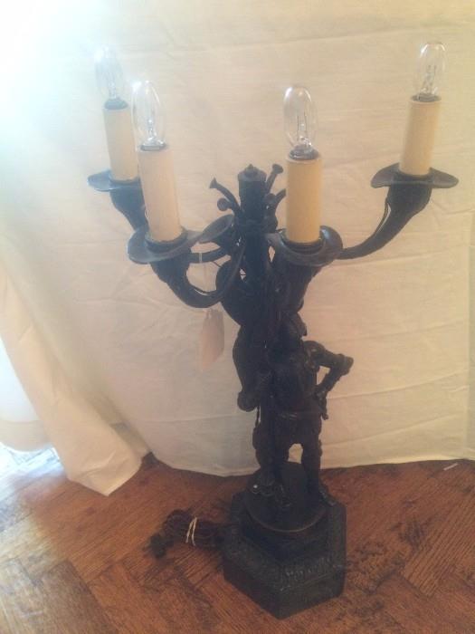 One of two bronze candelabras 