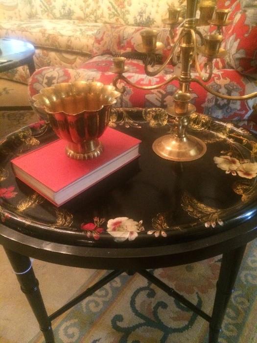 Black lacquered table; more brass accessories