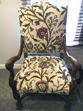 Antique Carved Walnut Arm Chair upholstered with stunning crewel work fabric
