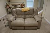 Leather Reclining/Rocking Loveseat. 