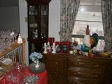ONE OF TWO SMALL LIGHTED CURIO CABINETS