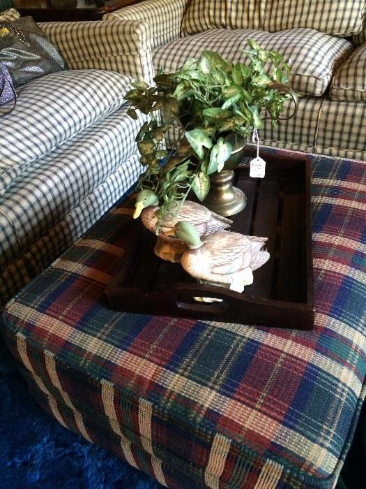 Plaid ottoman goes to two club chairs.