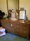 Provincial triple dresser has matching bed and nightstand