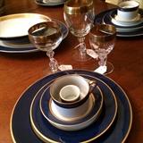 Gold trimmed dishes and stemware