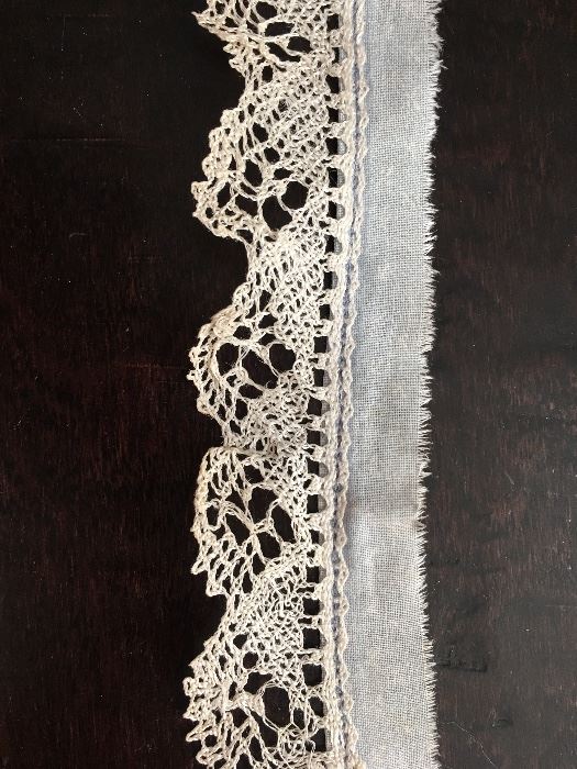 several yards of beautiful hand made bobbin lace, made by Mrs. Floeter
