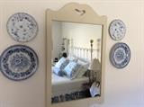 Antique white mirror, blue  and white vintage plates 