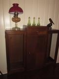 Art Deco cabinet w/ Bakelite handles, Antique shakers, Antique oil lamp