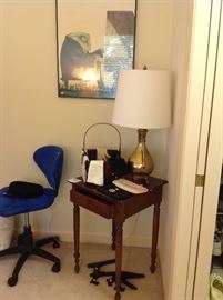 small side table with brass pitcher lamp, triangle blue office chair