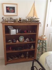  bookcase with many smalls and brass, ship model