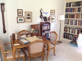 other side of the library featuring the marquetry game table wich has an extra leaf and four castered chairs. Note the long barometer on the left