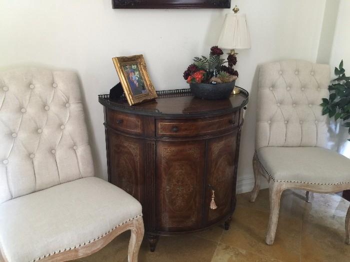 This Demilune (entry buffet) from Bliss Home Design, one of high end designer store in Corona Del Mar.  it is sure to be a great conversation piece. Two Chairs not included.  made by Theodore Alexander