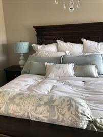 queen side bed.  headboard, footboard and side rails.  solid wood construction.  mattress and bedding also available to purchase separate.  two night stands also available.