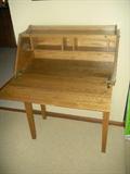 Oak secretary in like new condition with etched wheat pattern on front