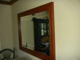 Oversized maple framed mirror finished with a cherry stain