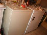 The G.E. washer looks almost new and the dryer, also a G.E., is not a whole lot older.
