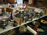 There is quite a bit of cookware and as you can see there are a number of pieces of Saladmaster and there are also a number of pieces of cast iron.