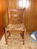 Papa always called these old chairs "spit-n-whittle" chairs. The woven rope seat is a nice touch. This would go well with the saddle and the porcelain sign in that western decor or in the man cave.