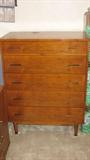 This mahogany Drexel chest of drawers features a Mid-Century Modern style and is a companion piece to a mirrorless dresser.  It could work as a bedroom piece or as a piece in any room of the house where you need style and storage.