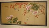 I have seen Byobu screens like this displayed with care and reverence in many museums.  As is the tradition in many Asian screens, the motif is serene florals on a natural silk background color in this four-panel screen, displayed here as wall art.  The frame is dark-stained wood and can function as either a continuous frame, as pictured here, or can allow the screen to be free-standing on a surface.  I cannot vouch for the age of this screen, but I can say that it is of very high quality and likely to be an antique.  It is signed.