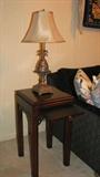The 13-inch square table top of this part of the mahogany Asian-inspired Drexel set also has a pull-out shelf.