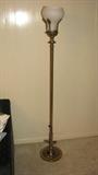 The torchier is not likely to be an actual antique, but it is a good reproduction.
