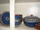 This attractive set of pottery is maked Bulgaria and has a blue field with an interesting hand-made geometric pattern adorning it.