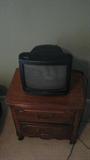 Here, the nightstand does double duty as a TV stand as well. (The television is for sale as well.)