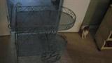 It's a little hard to tell from the photo of it, but this rolling cart is metal and could be equally at home inside the house, displaying items, or on the patio or porch with plants on its shelves.