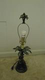 Exotic is the way with a lot of the items at this sale, and this palm tree-inspired metal lamp is no exception.