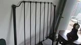 The iron headboard is just screaming out for a room and some rich fabrics on the bed!