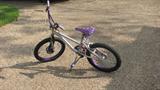 This purple child's bike is about the right size for a 5 to 10-year-old, depending on weight and height. The brand is "Next," and it is purple
